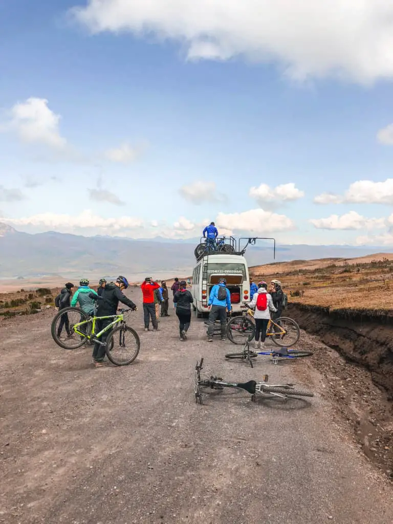 The van and people getting the mountain bikes