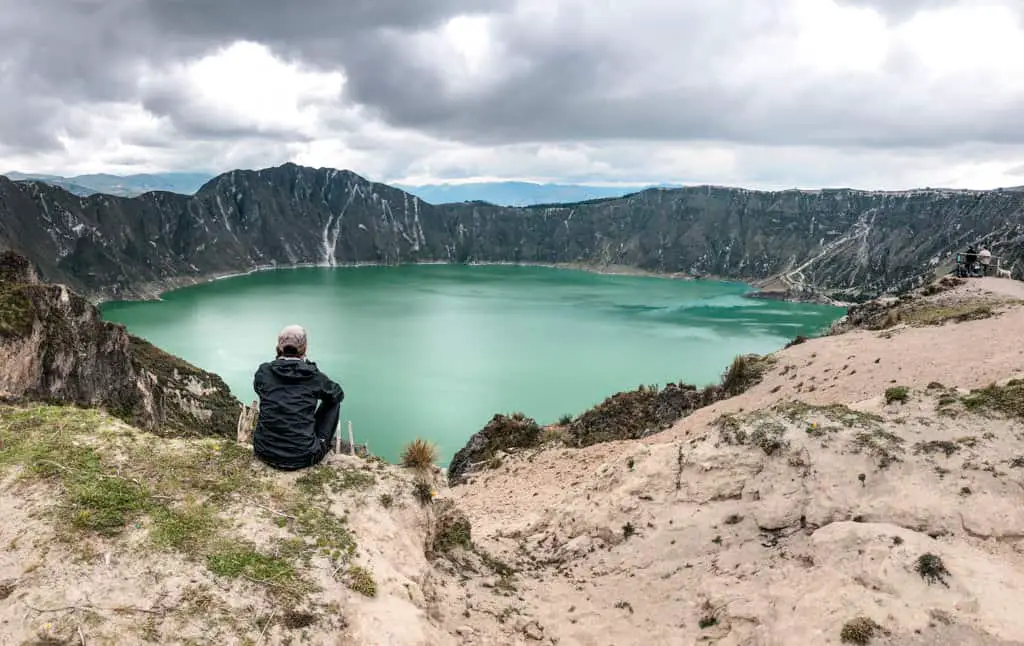 First view of the turquoise blue waters of quilotoa crater lake