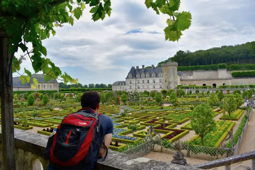 Nomadic Matt overlooking a castle garden