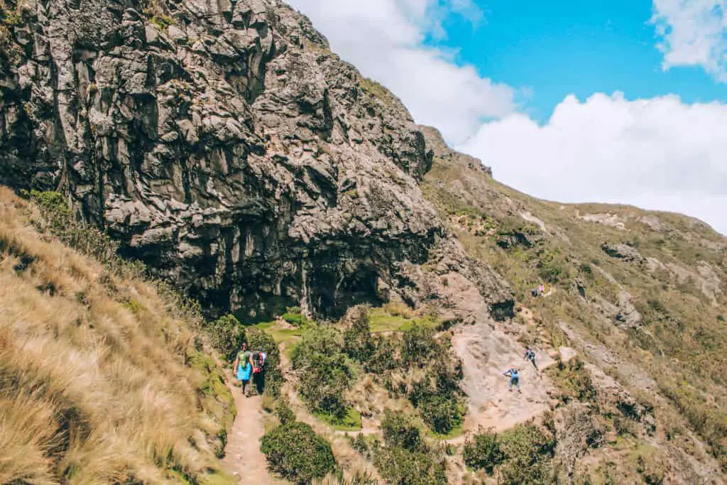 Climbing the rock face on the hike to Pichincha