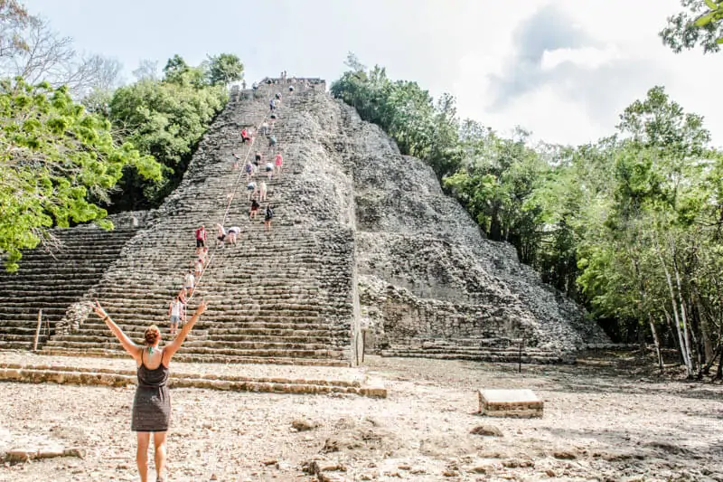 Climbing the steps of the Coba pyramid is a must on your Yucatan road trip itinerary.