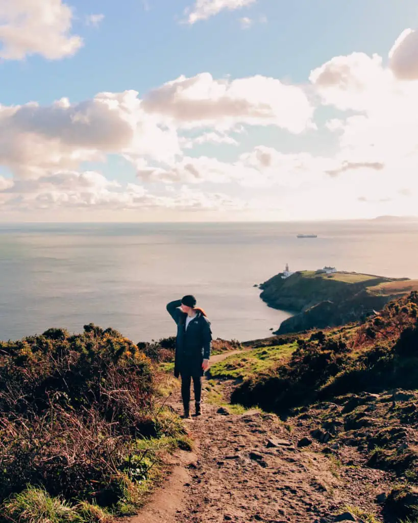 Woman standing on Cliff Path in Howth Ireland.