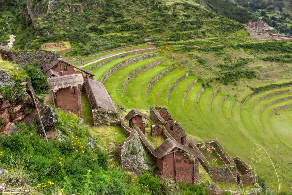 Some of the buildings of the Pisaq complex with the terraces in the background