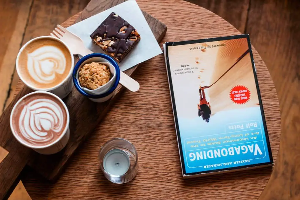 Coffee cups with a book on a table