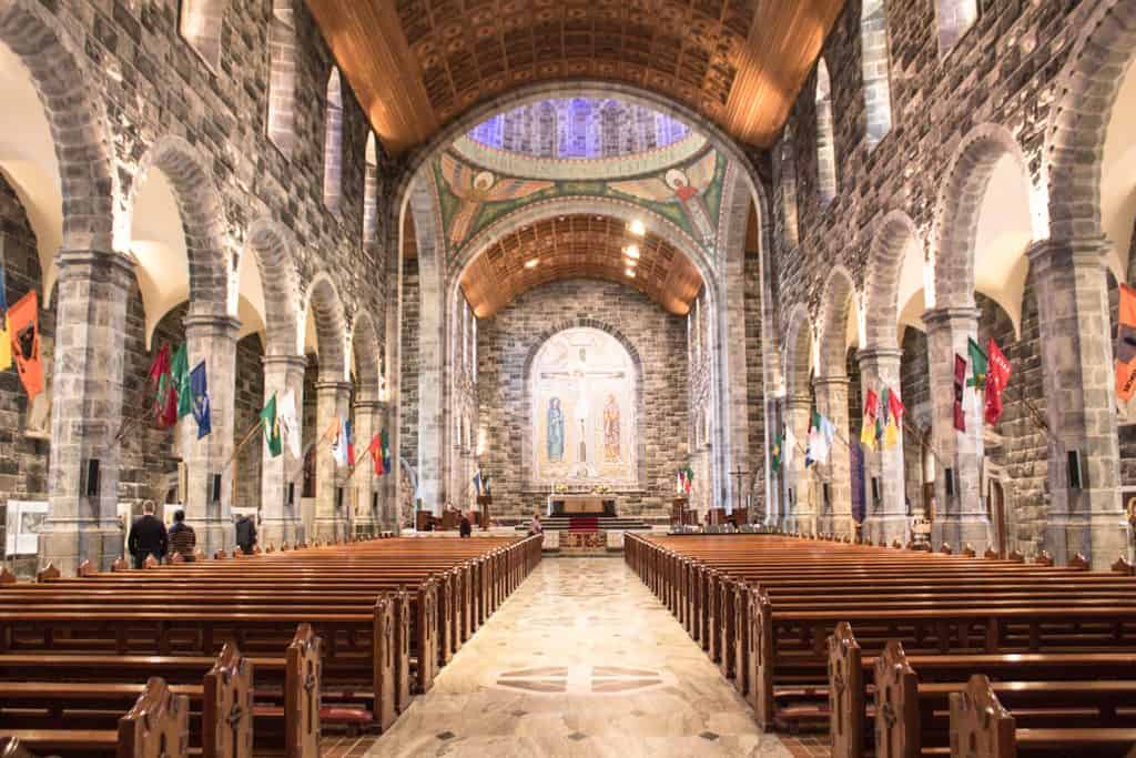 The interior of Galway Cathedral with its large arches columns and decorative mosaics.