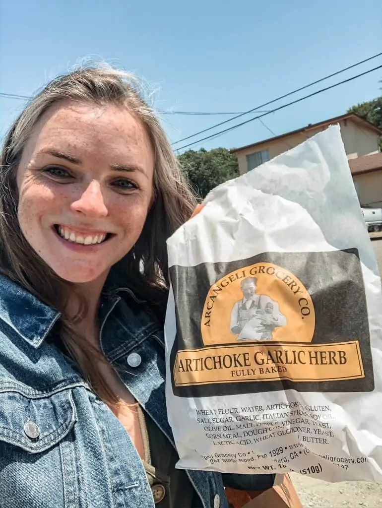 Me with Artichoke Garlic Bread from Arcangeli's Market