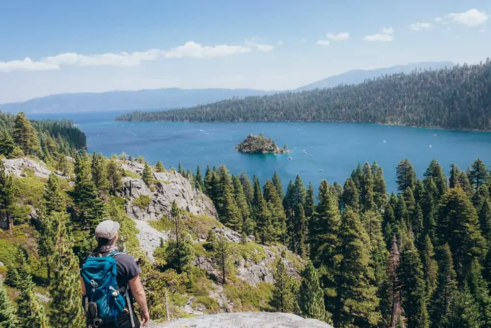 Overlooking Emerald Bay in Lake Tahoe carrying my new day hiking backpack that holds all of my short hike essentials.