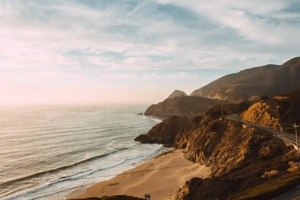 Winding road on the California Coast at sunset as seen from Gray whale cove hike in Half Moon Bay, California