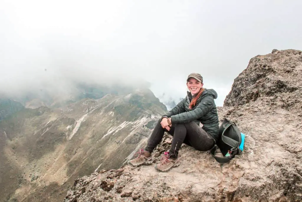 Sitting on top of the volcano in Quito after a day hike wearing my favorite short hike clothes.