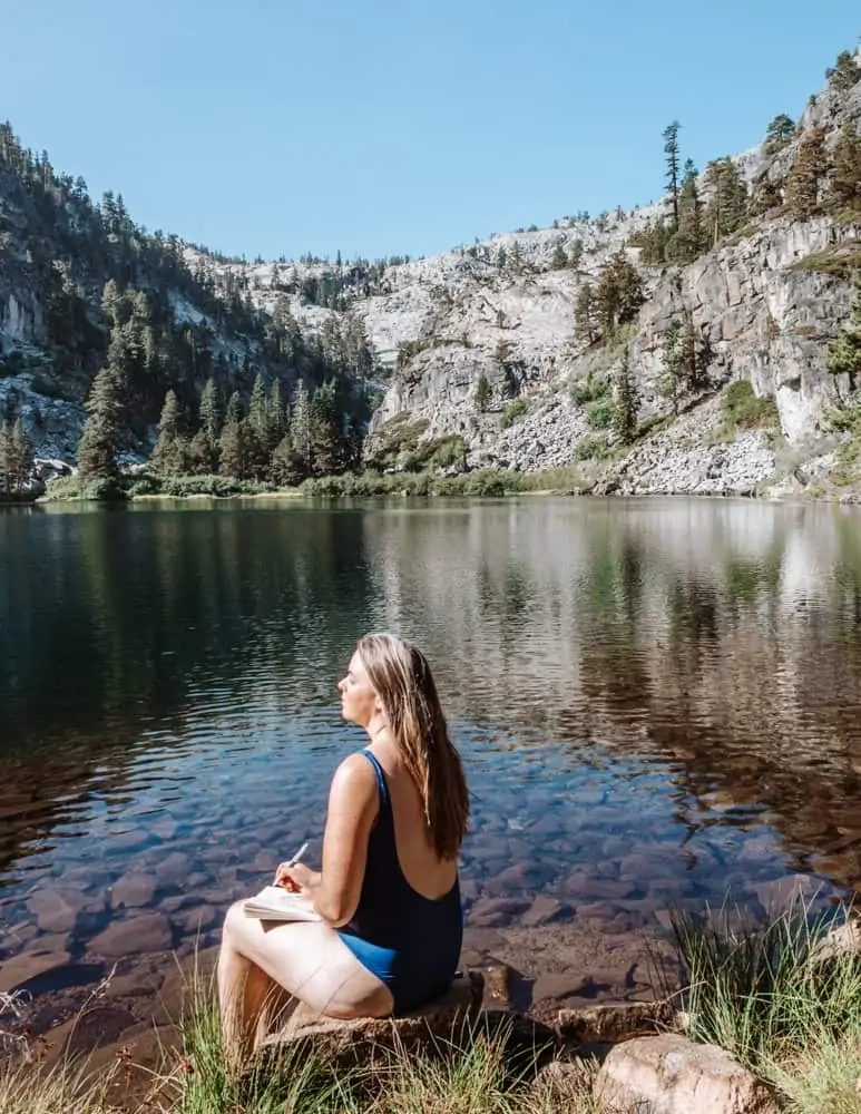 Me sitting on a rock journaling at Eagle Lake, Lake Tahoe, CA