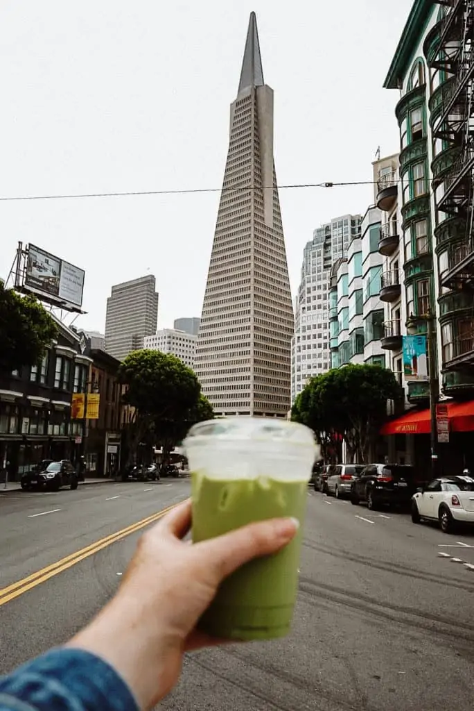 matcha latte from Reveille with the Transamerica building in the background.