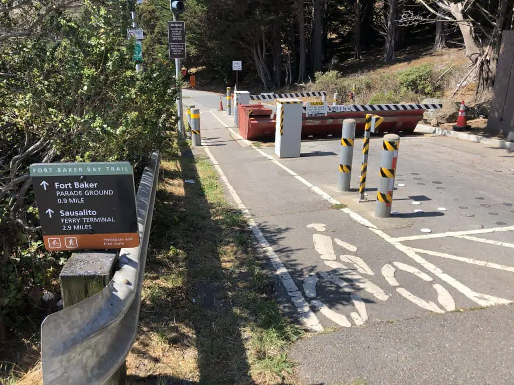 A sign post directing to Sausalito and a bike road.