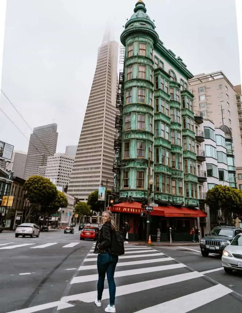 Crossing the street in front of the Sentinel and Transamerica buildings in North Beach, CA