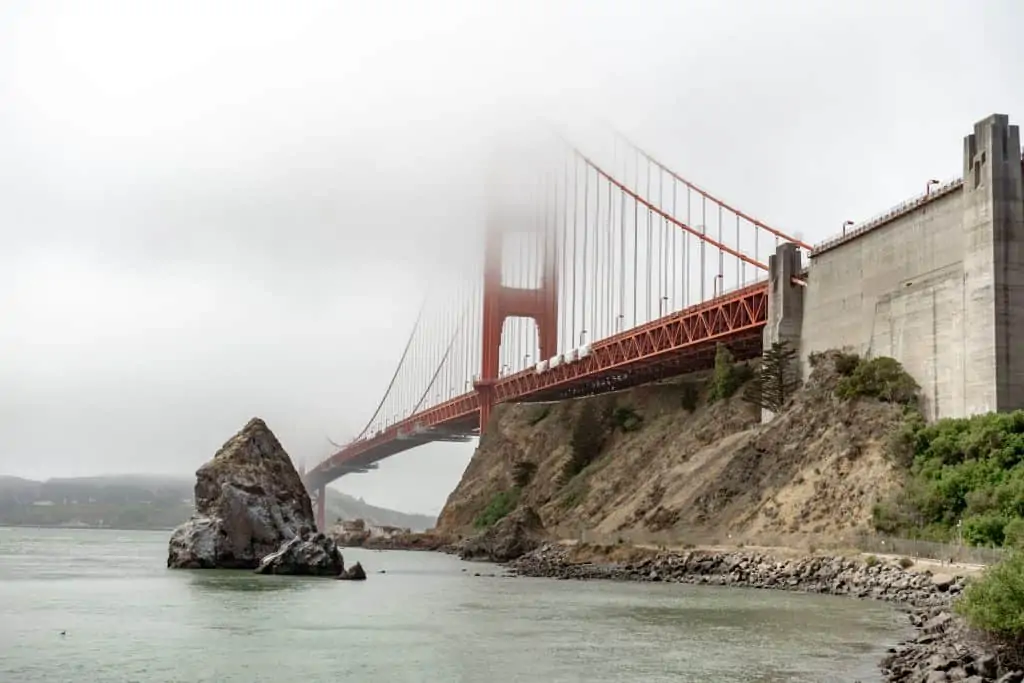 The Golden Gate Bridge covered in fog.