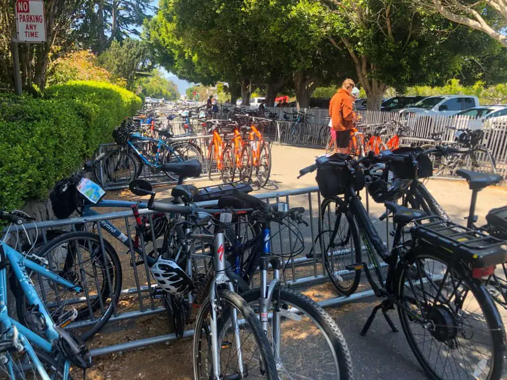 A street filled with bikes locked on bike racks in Sausalito,  CA