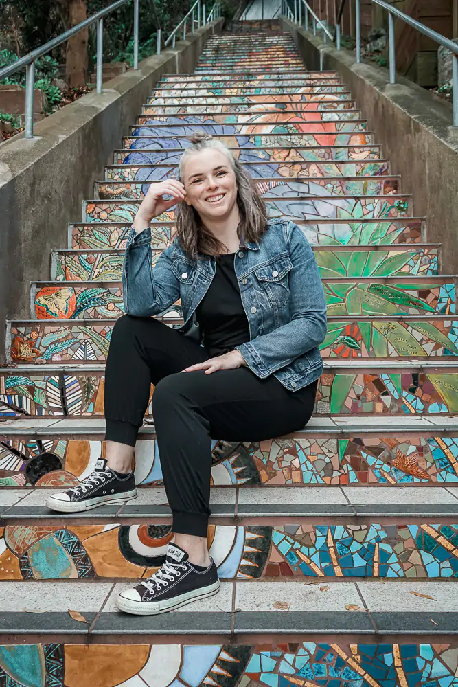 Me sitting on the Hidden Garden Steps in San Francisco, CA