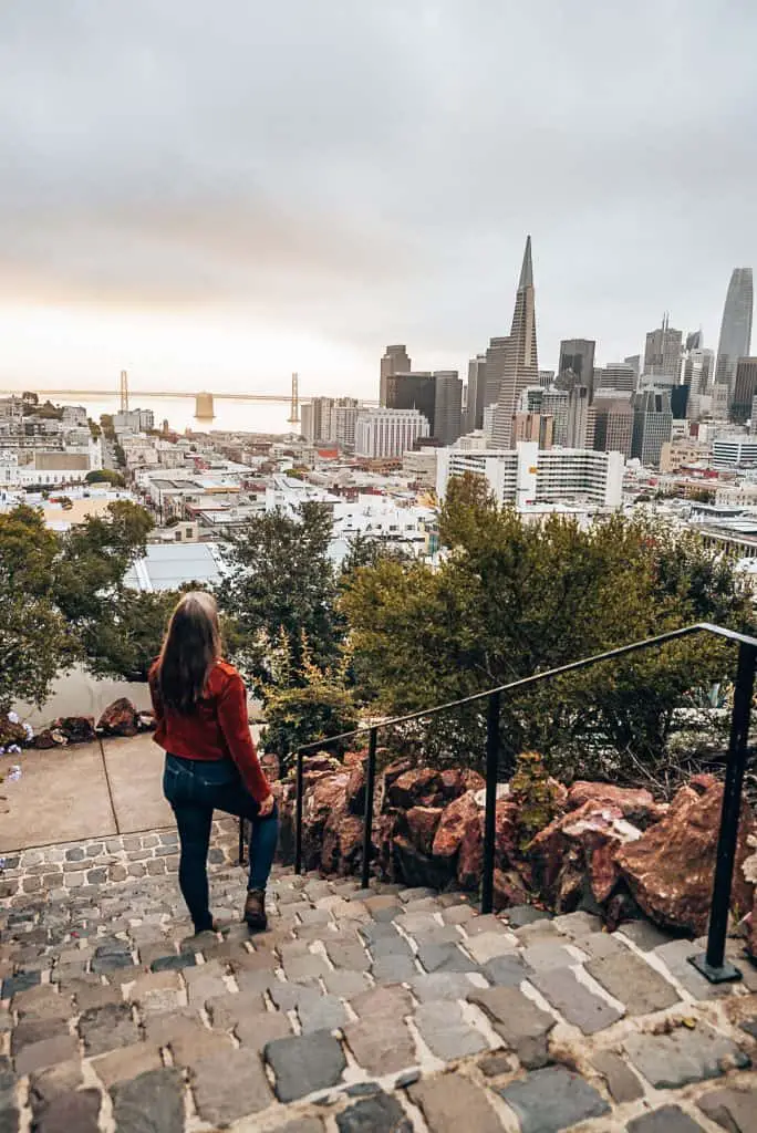 Me looking towards the Transamerica building from Ina Coolbrith Park, one of the most Instagrammable places in San Francisco