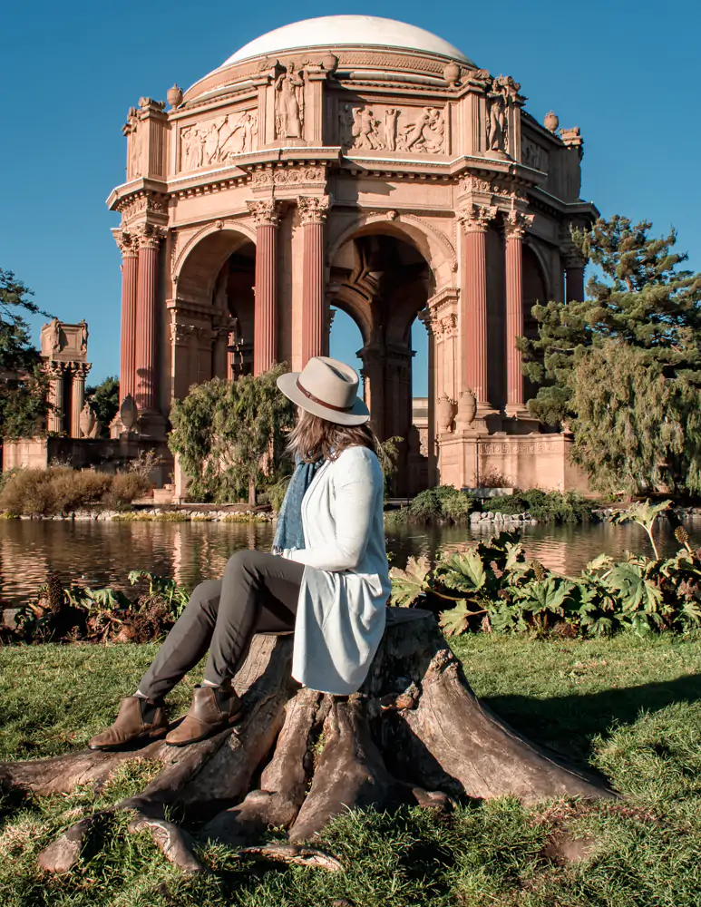 Me sitting on a tree stump in front of the Palace of Fine Arts, San Francisco, CA