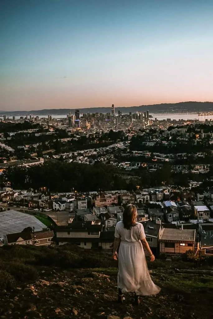 Sunrise on Mt. Davidson with San Francisco skyline in the distance.