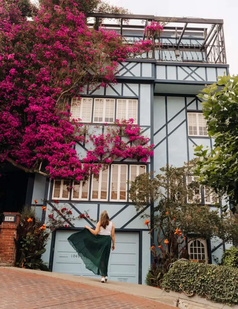 Standing in front of the Bougainvillea house on Lombard Street in San Francisco, California.