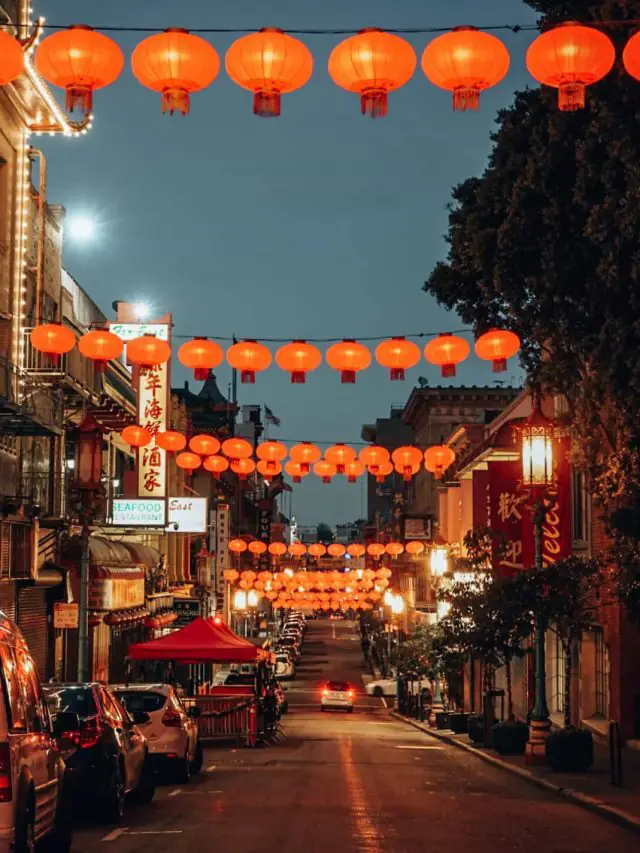 Chinatown at night with lanterns strung across the street. Things to do in Chinatown, San Francisco