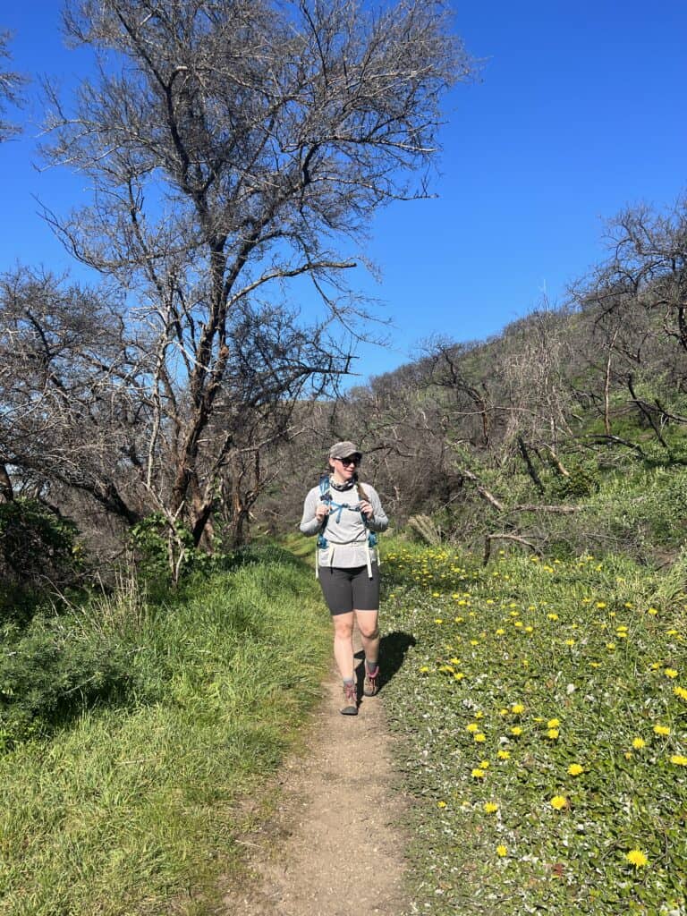 Me walking the Coastal trail surrounded by wildflowers in Point Reyes