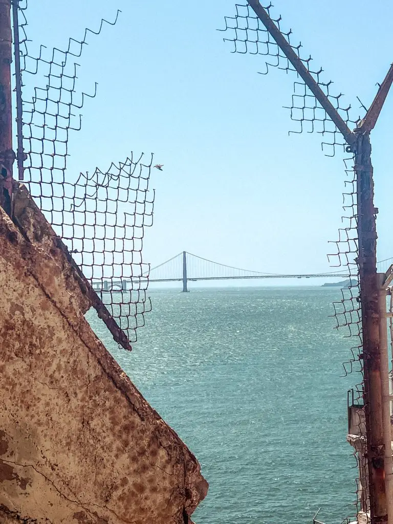 View of the Golden Gate bridge from the Alcatraz recreation yard