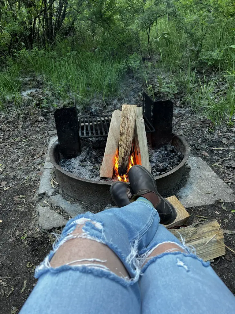 Boots by a campfire.
