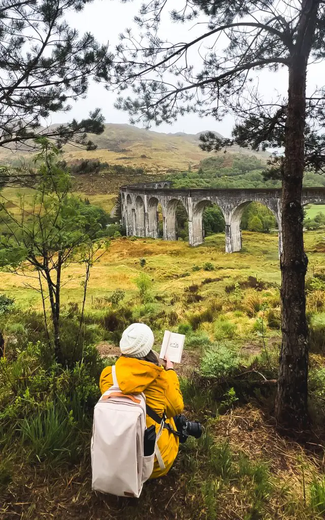 Wearing my Nordace Backpack and yellow rain jacket while waiting for the Jacobite steam train in Scotland.