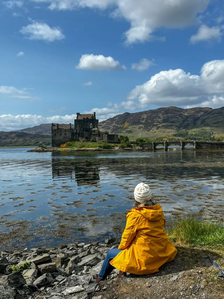Me sitting on the shores of the lake looking at Eilean Donan Castle.