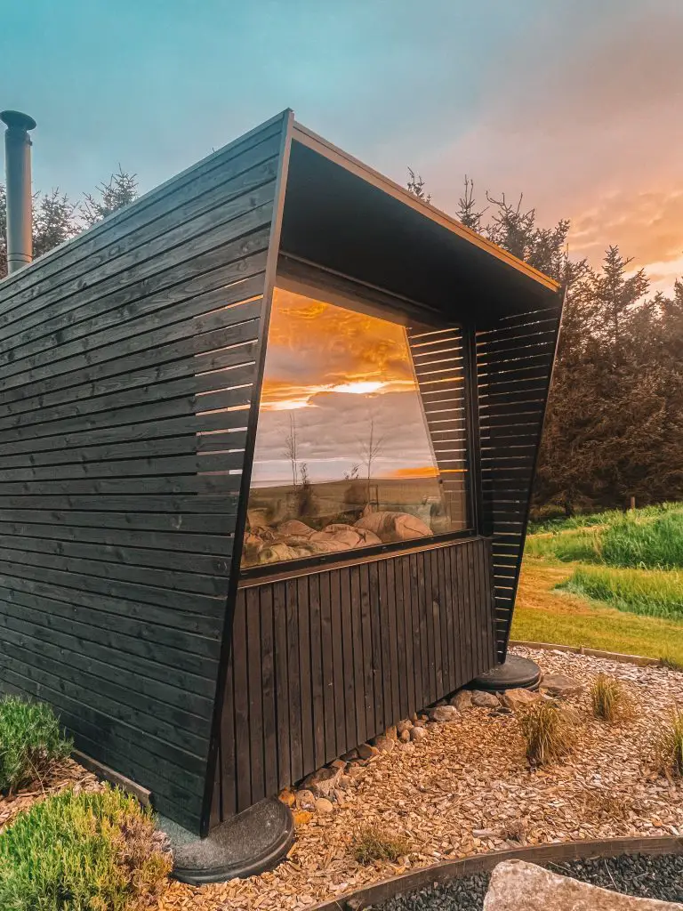 Cozy cabin at sunset.