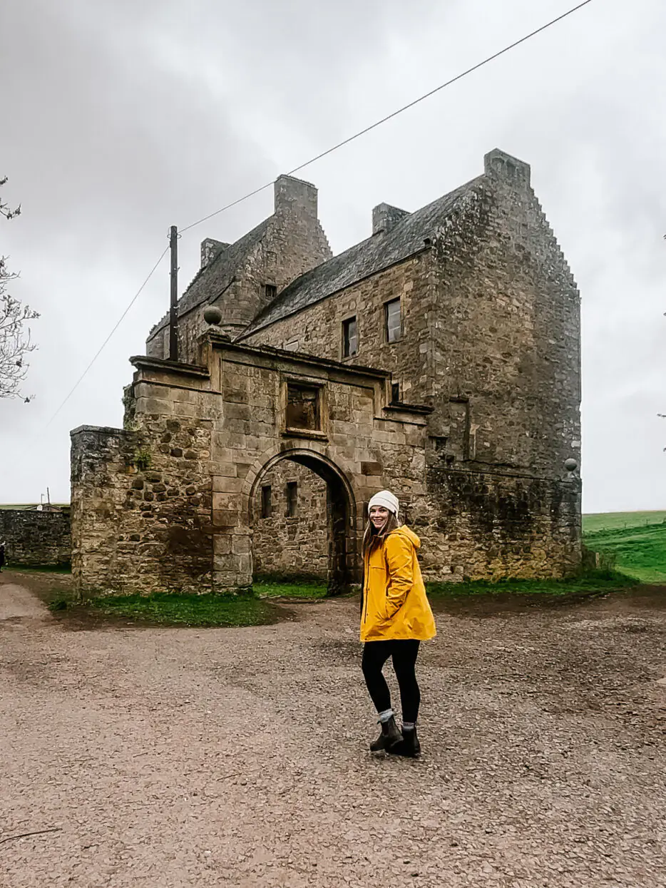 Me walking toward Midhope castle in Scotland.