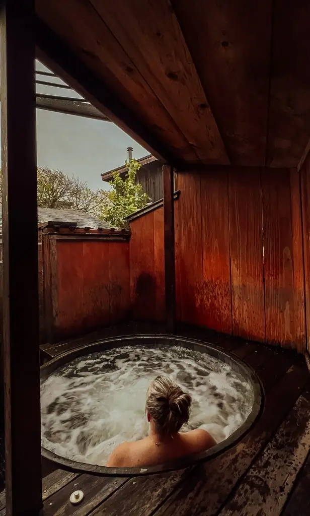 Me soaking in a redwood hot tub.