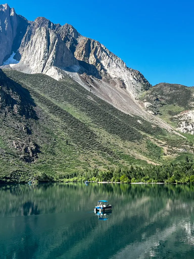 A boat fishing in the middle of Convict Lake, California