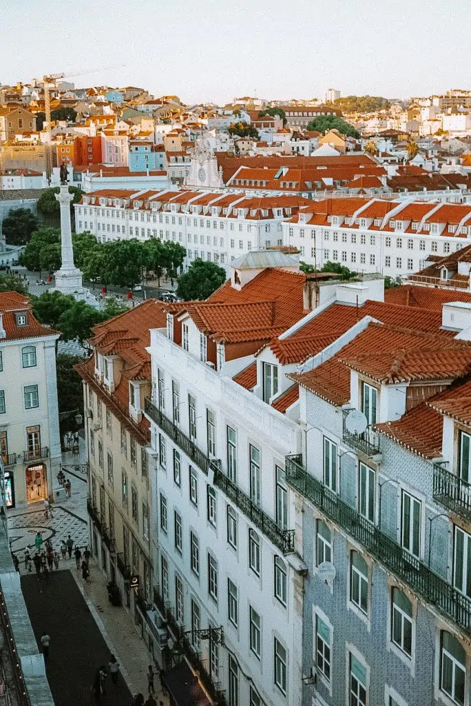 View of Rossio Square and terracotta rooftops from Santa Justa Lift in Lisbon, Portugal.