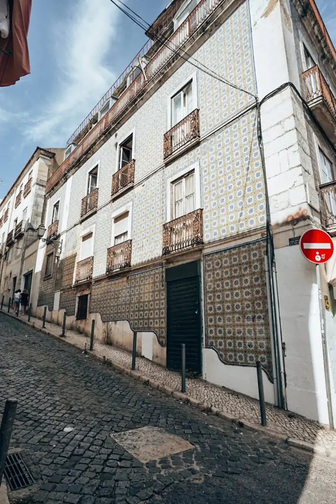 Tiled building on a steep street in Lisbon, Portugal.
