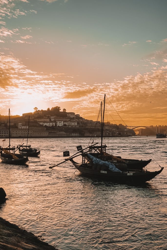 Sunset with the river boats in Porto, Portugal.