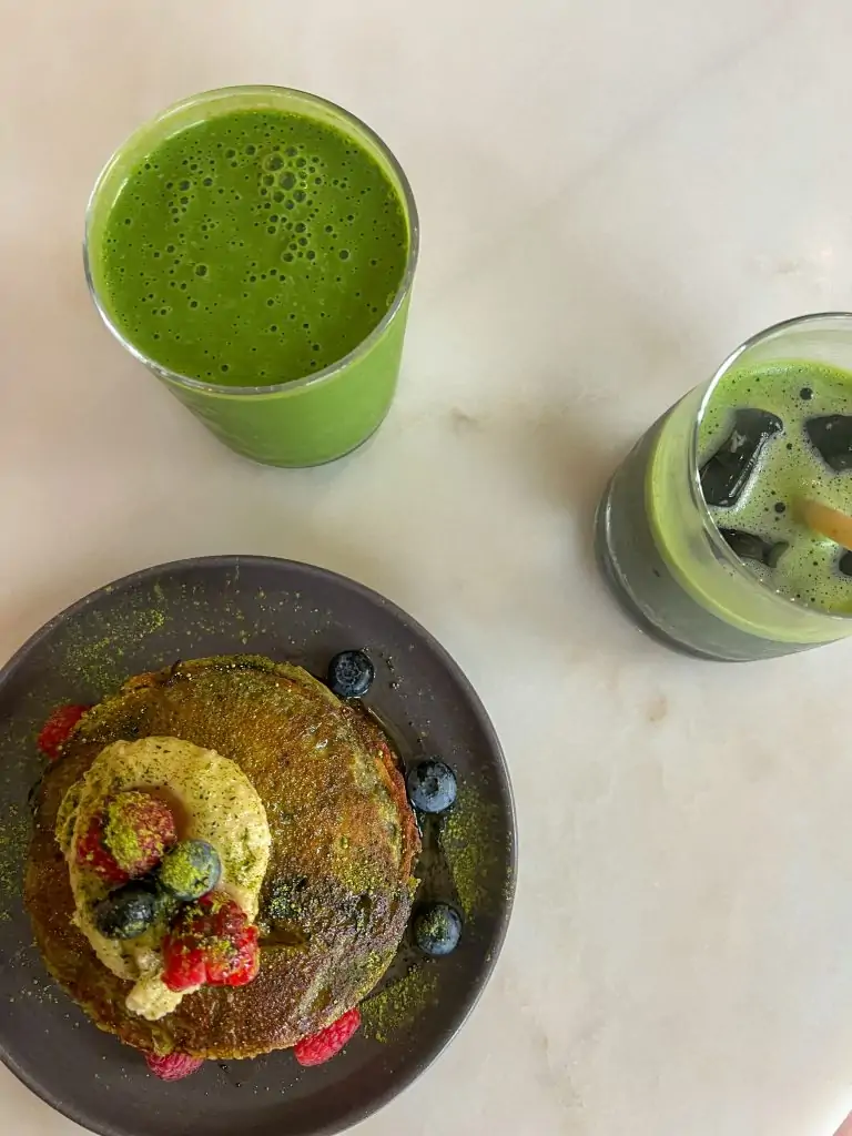 Pancakes and two green beverages from Comobå in Lisbon, Portugal.