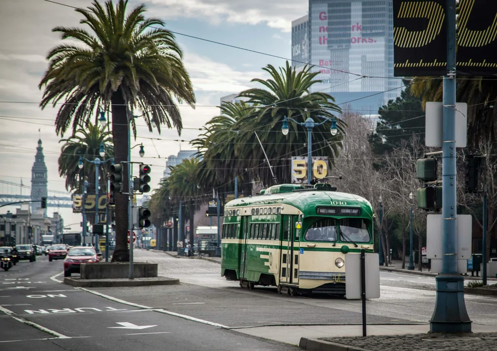 Trolly and cars driving on the Embarcadero in San Francisco, CA. 