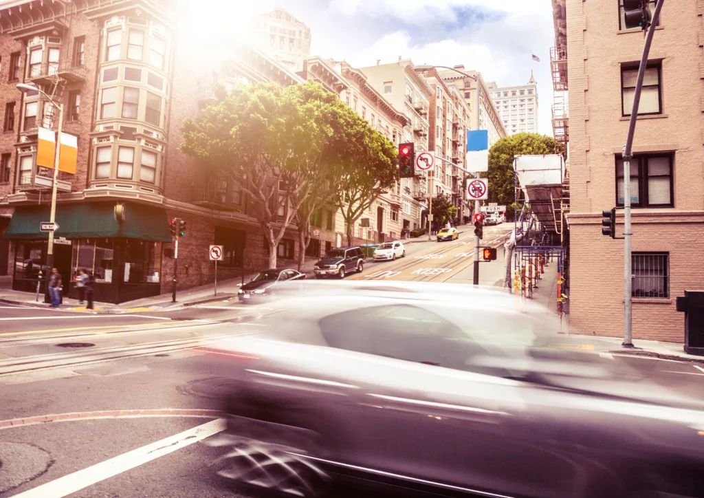 Car speeding through an intersection in San Francisco, CA.