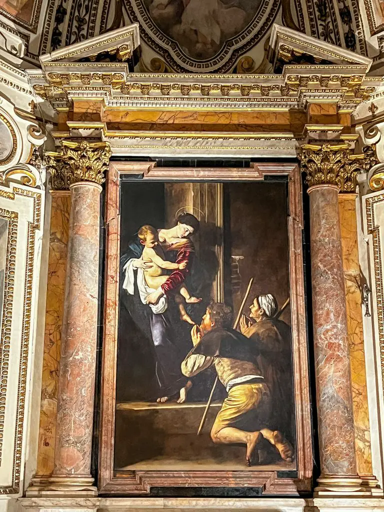 Madonna of the Pilgrims by Caravaggio in Basilica of Saint Augustine in Rome, Italy.