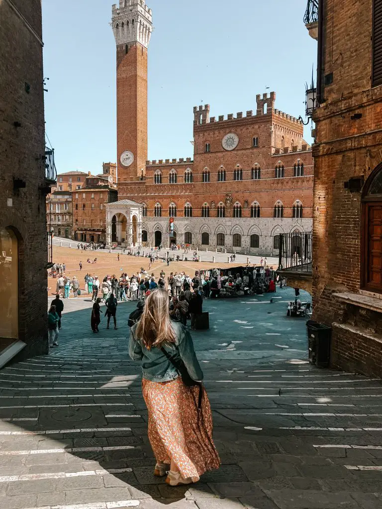 Walking towards a plaza in Siena, Italy.