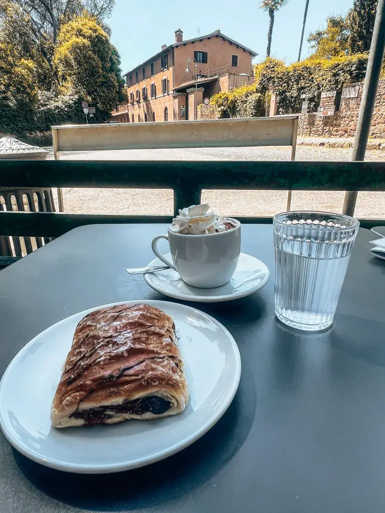 Coffee and croissant at the Appia Antica Cafe on the Appian Way in Rome, Italy.