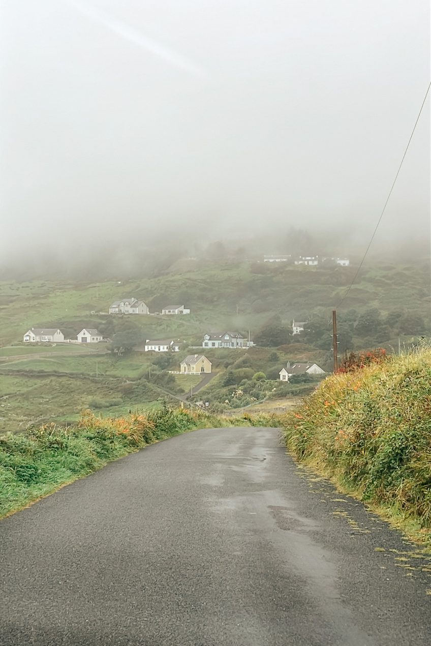 Windy Irish road on a misty rainy day in Donegal, Ireland.