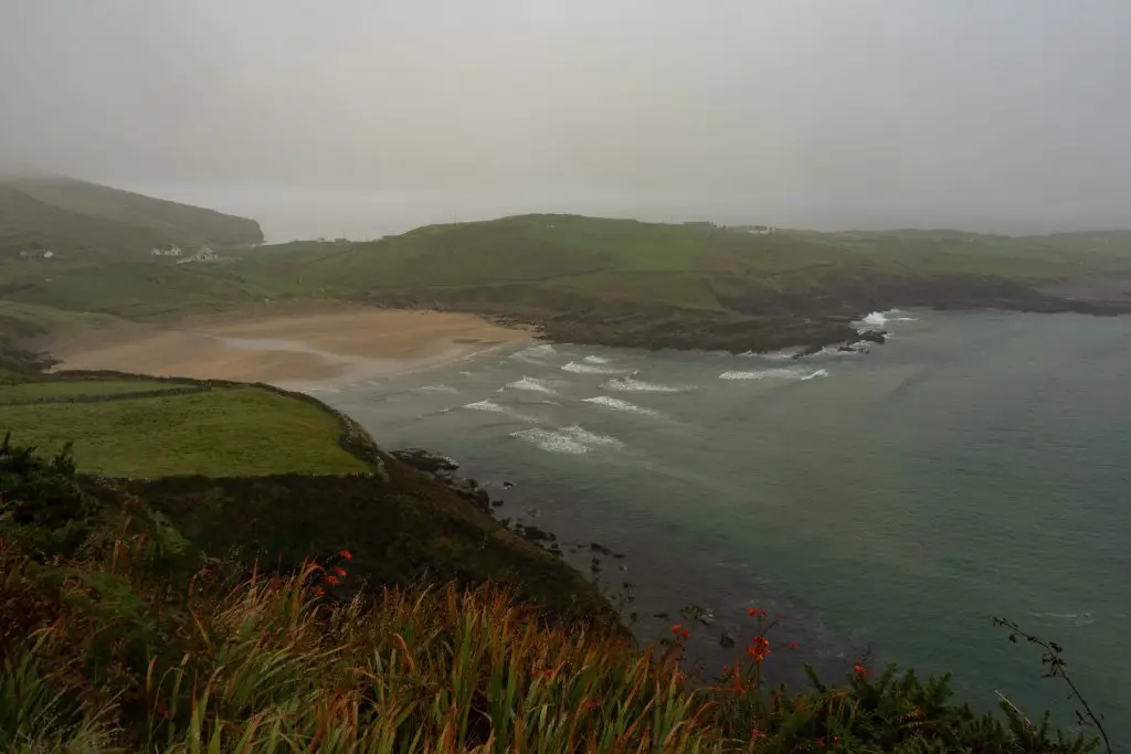 White sand beach in the rain in Donegal, Ireland.