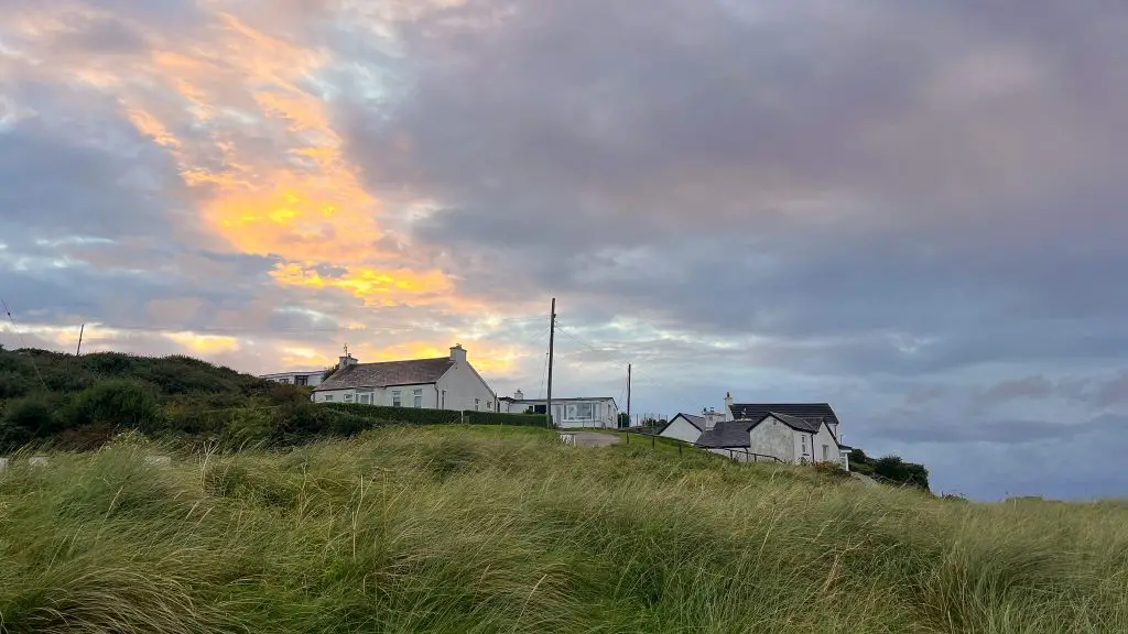 Sunset over homes in Donegal, Ireland.