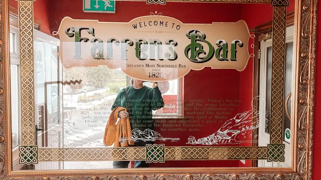 Photo in front of Farrens Bar sign in Donegal, Ireland.