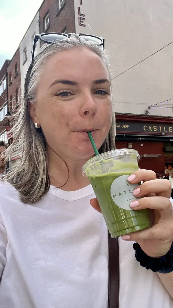 Me drinking a matcha latte in Dublin, Ireland.