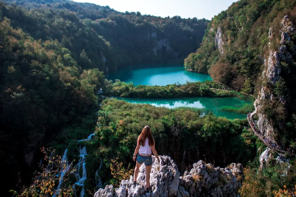 Katie standing at overlook of Plitvice Lake National Park in Croatia.
