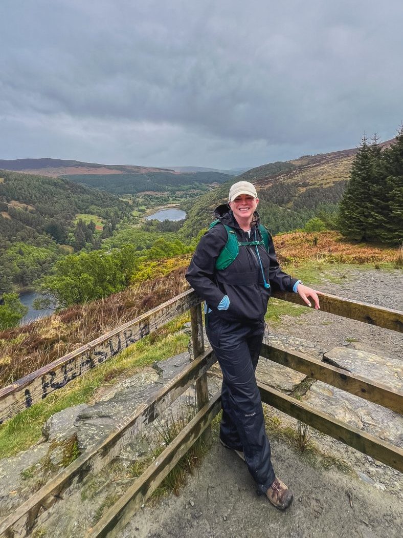 Katie standing at overlook in Glendalough National Park, Ireland.